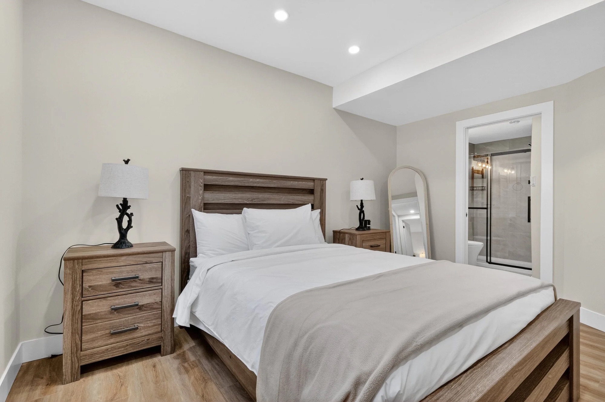 Bright bedroom with a queen bed and en-suite bathroom