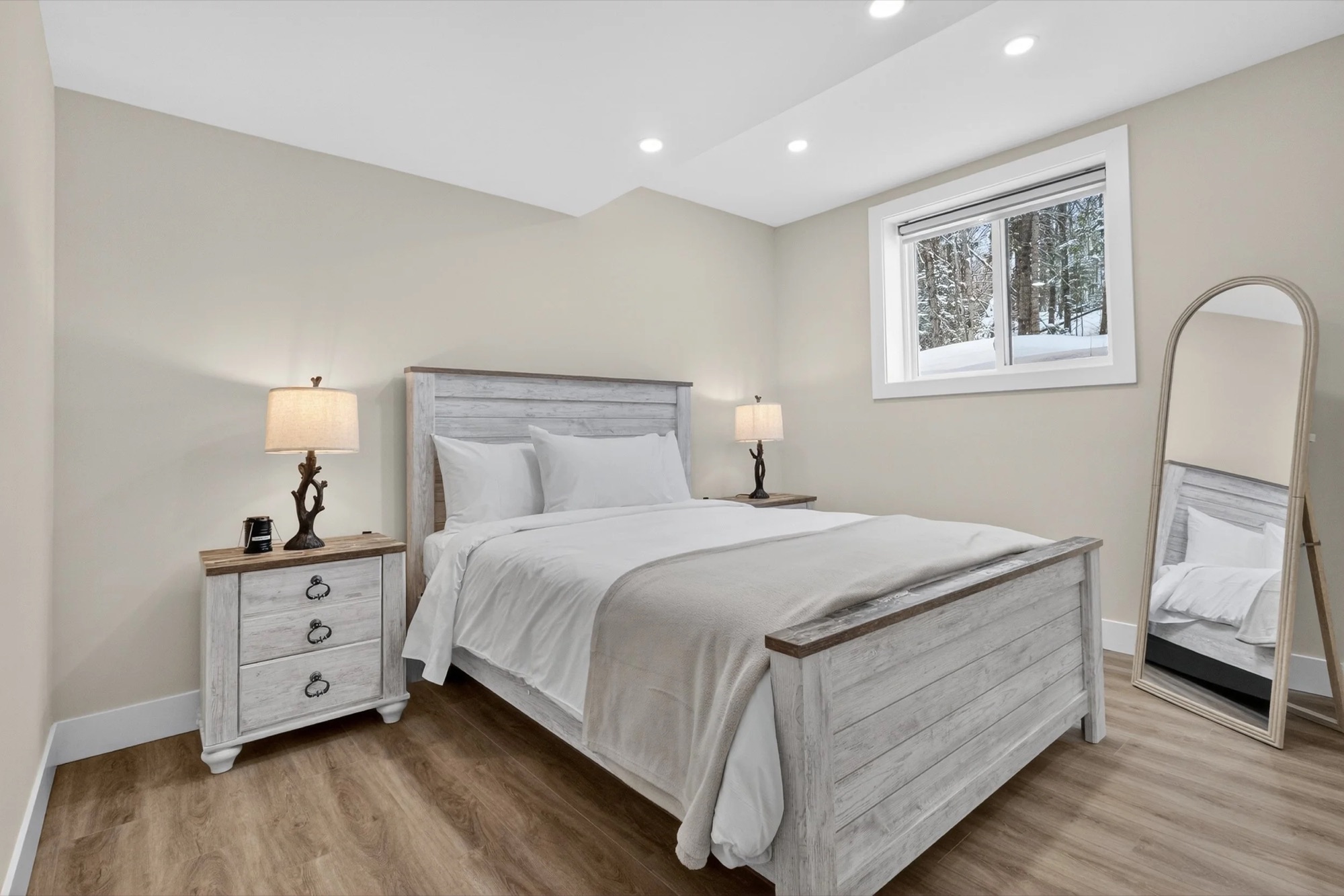 Bedroom 3 — queen bed with a forest view window