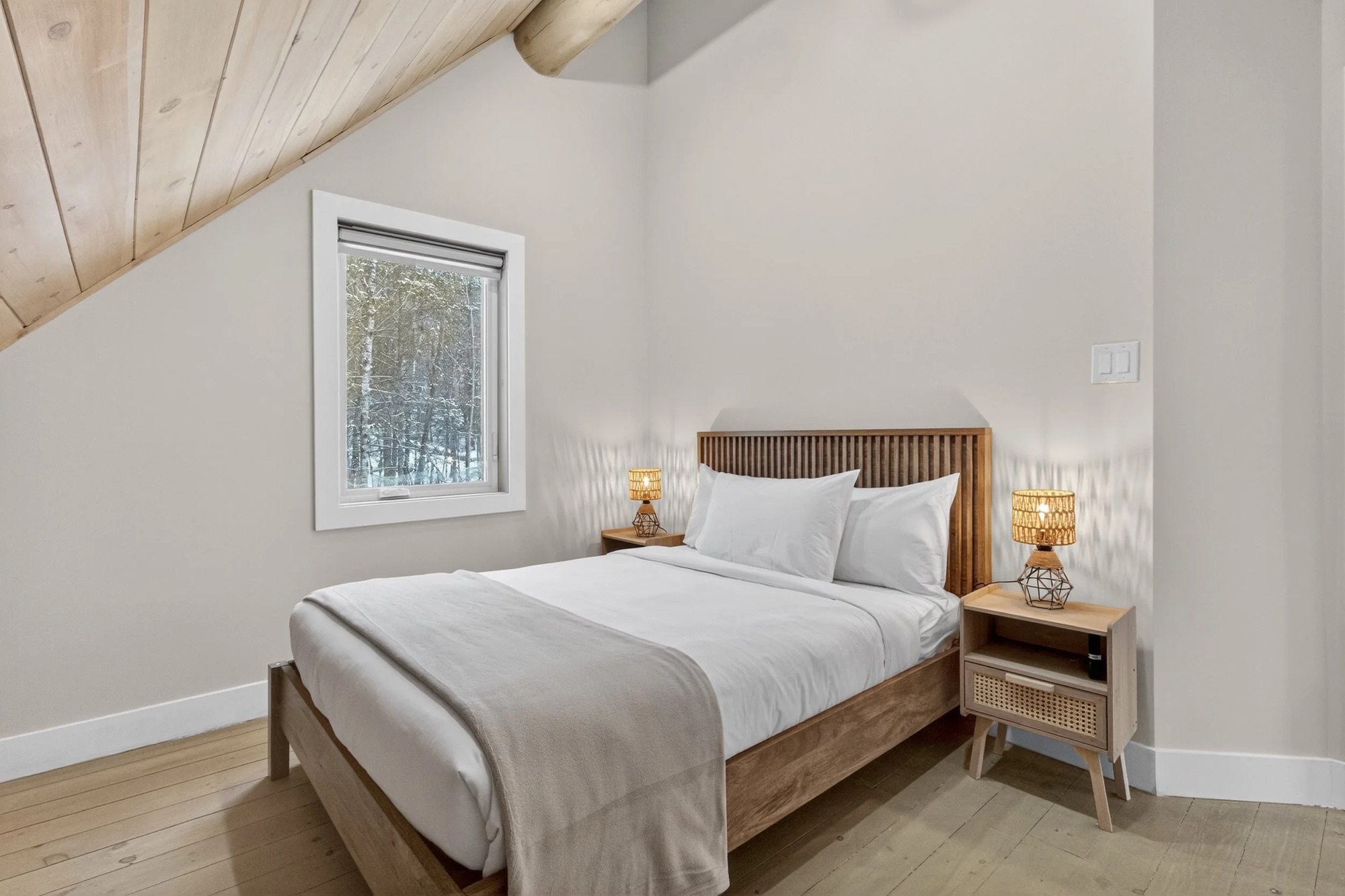 Bedroom 4 — double bed under the angled roofline