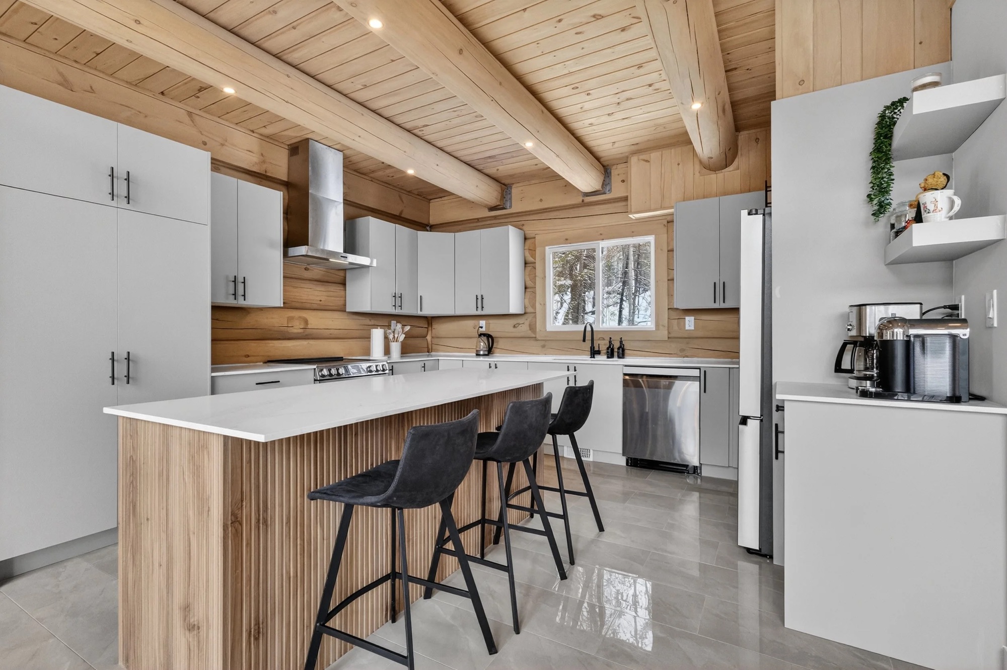 Modern kitchen with wood beams and a large island